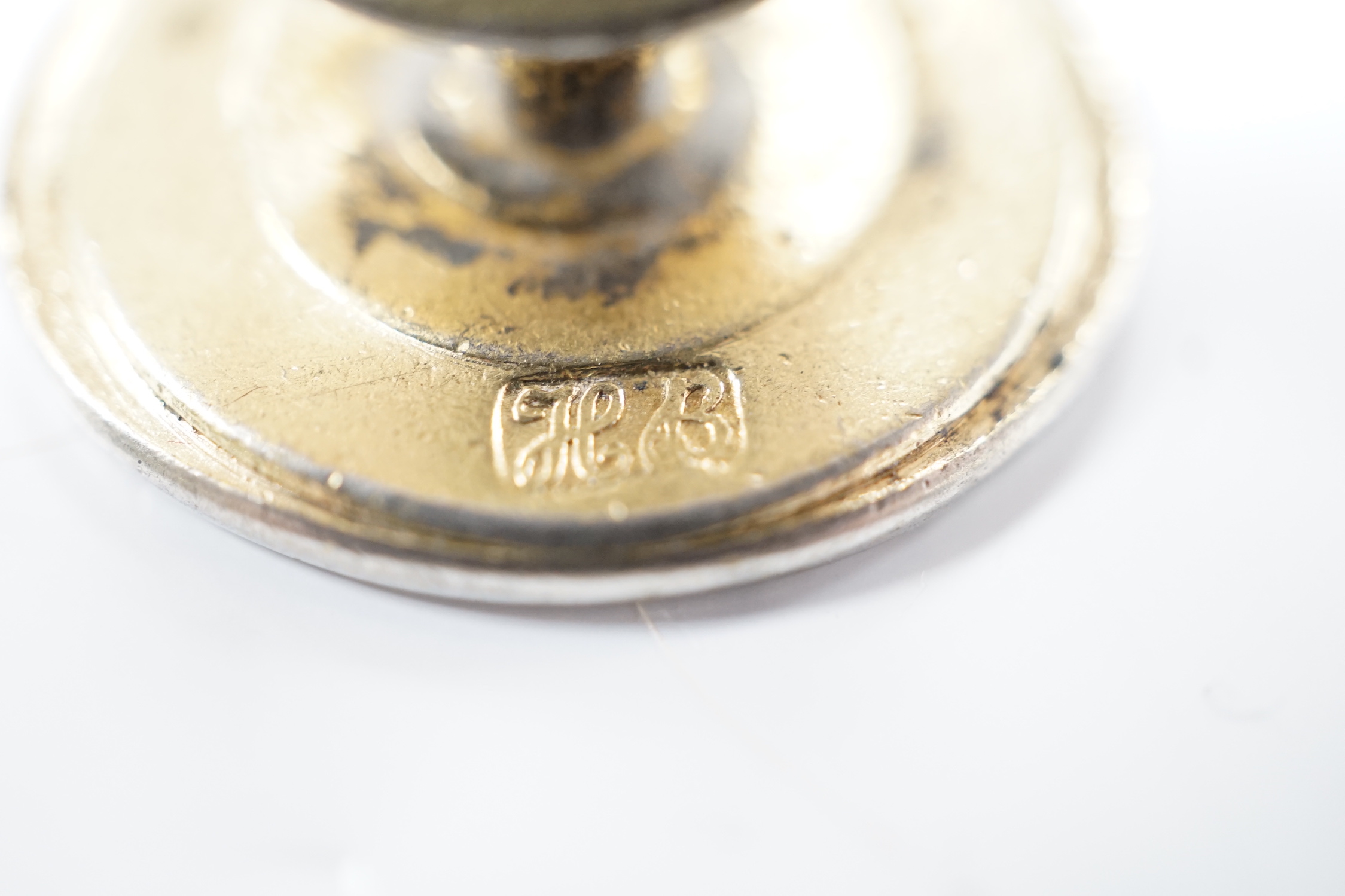 A George III parcel gilt silver fob seal, by Hester Bateman, London, circa 1770, 23mm, the matrix with crested monogram.